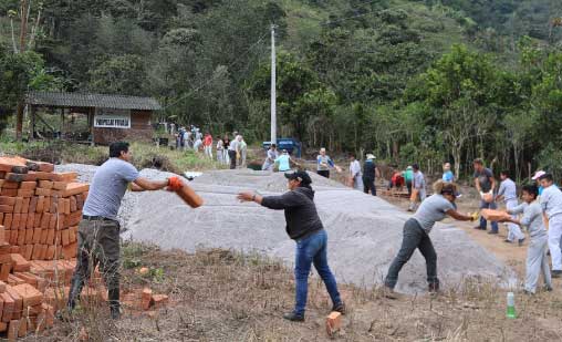 People working with sand bags